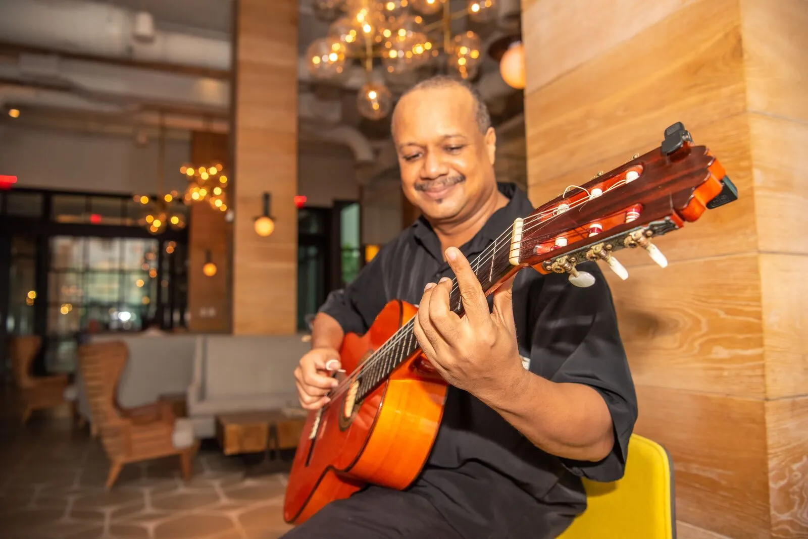 Musician playing guitar - Kimpton